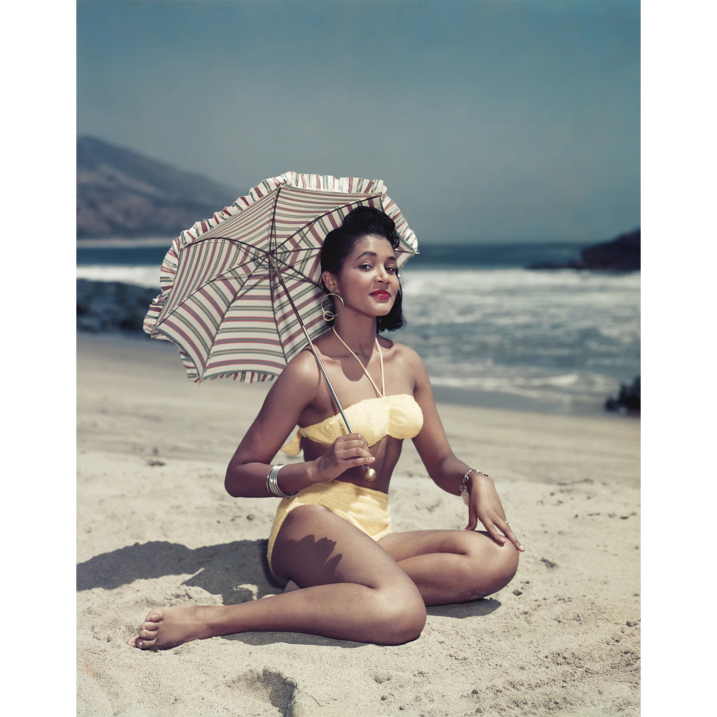 "Woman on Beach Holding Umbrella" from Getty Images - Image 3